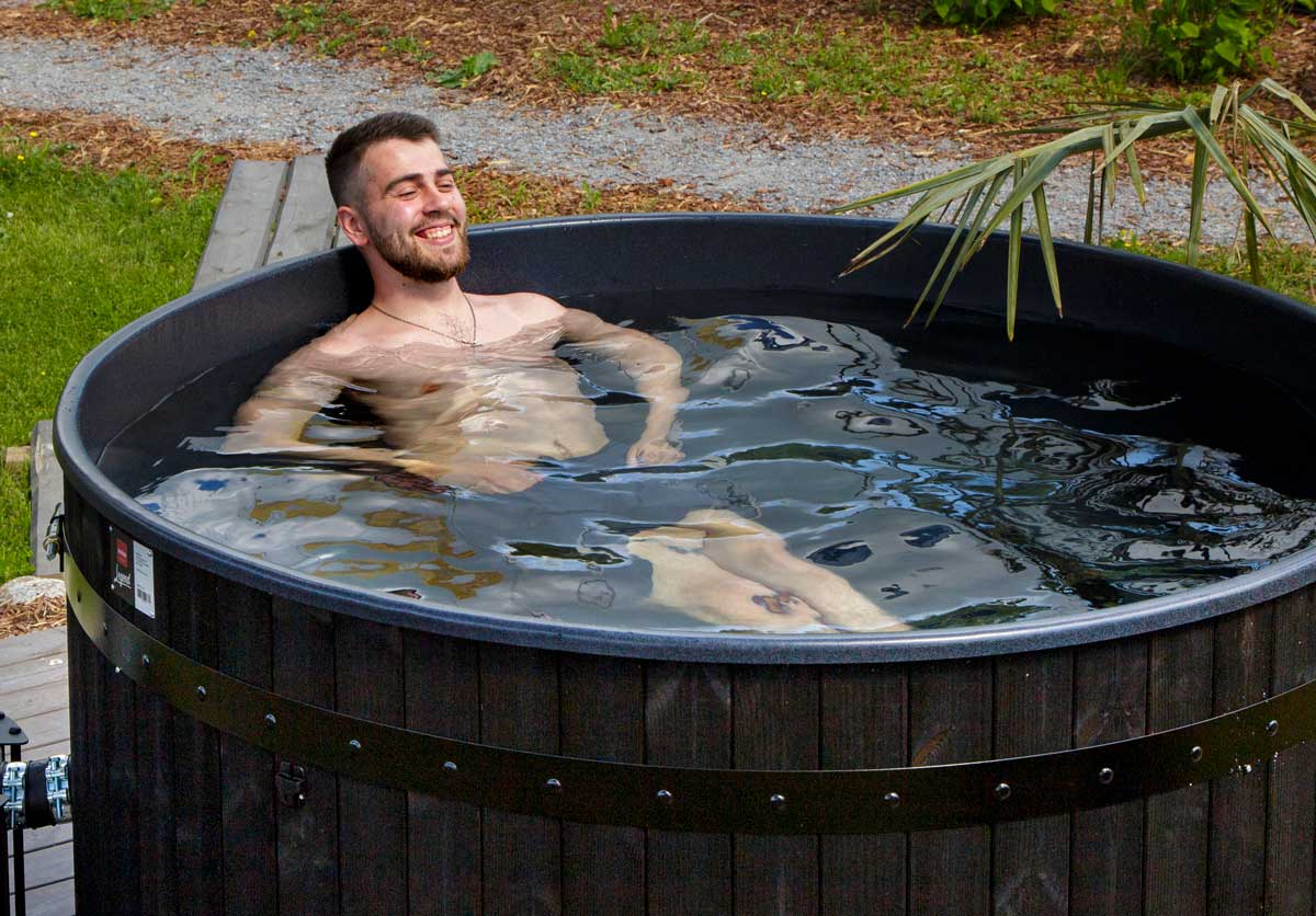 unded by rays of sunshine and a wooden fence, creating a cozy sauna and spa atmosphere